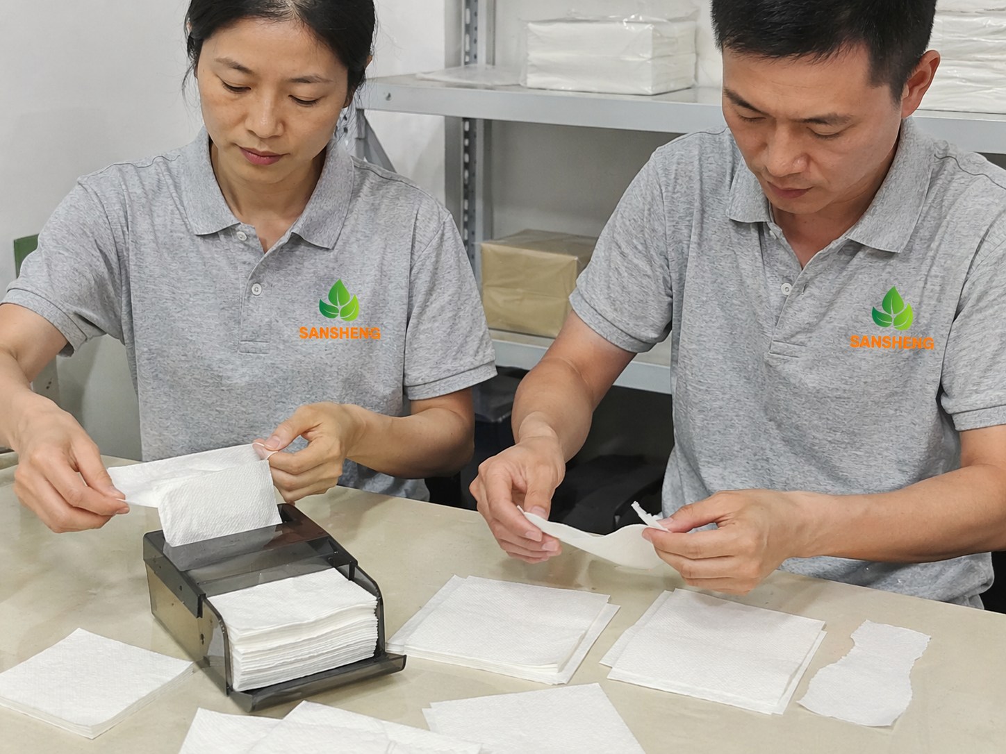 Paper napkin tearing during use or dispensing due to weak ply bonding or fold control