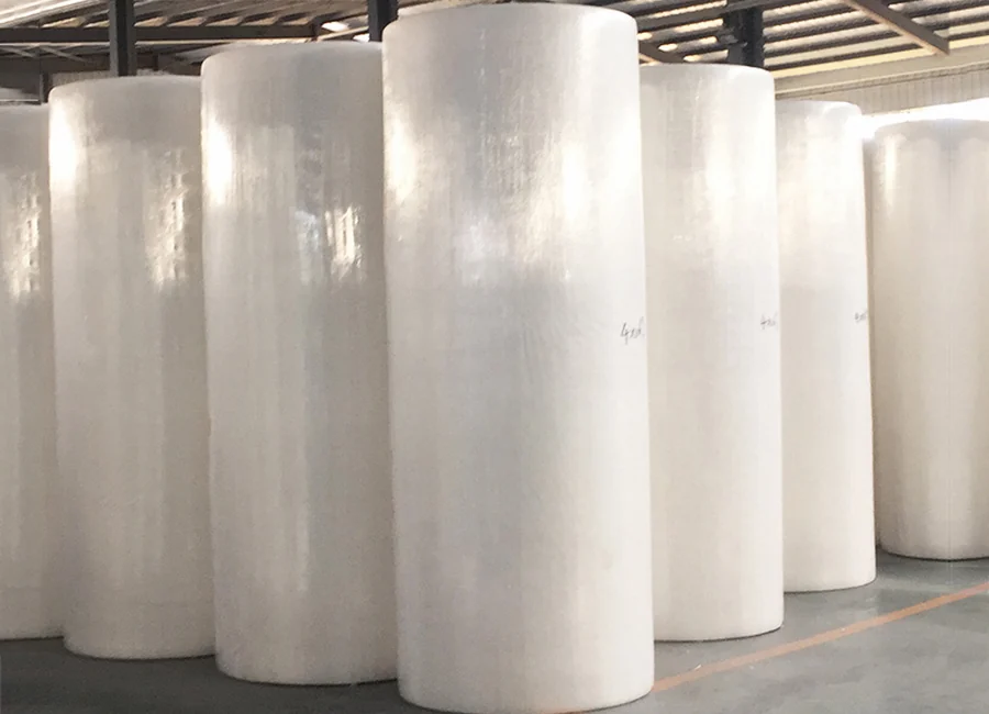 Bulk industrial wipe rolls stacked for distribution