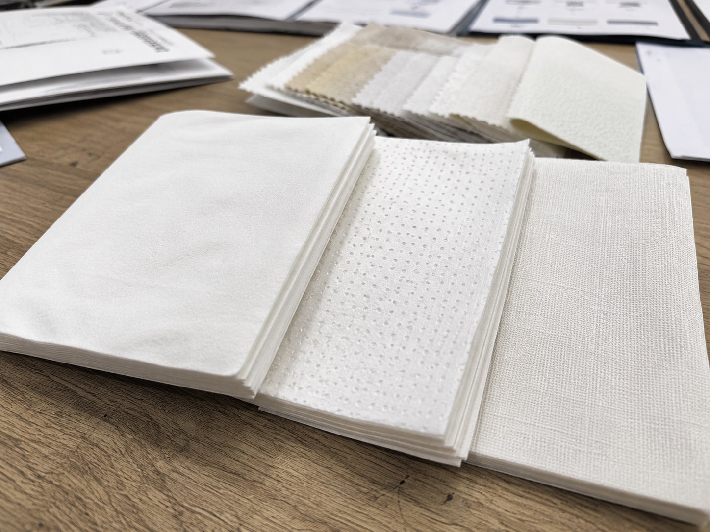 Airlaid napkins bulk embossing and texture review with plain dot embossed and linen-like surface samples