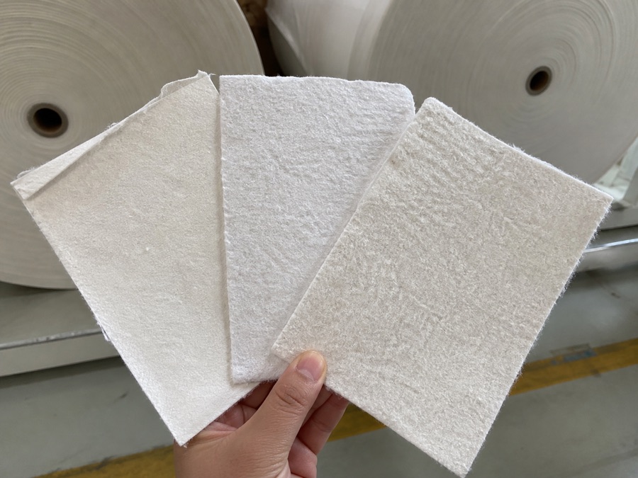 Three airlaid sheet structures compared by density and fiber bonding