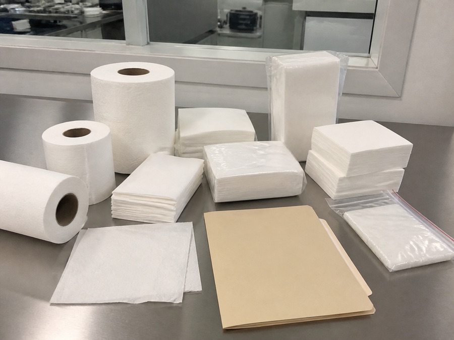 Unbranded bamboo tissue packs and blank evidence folder for scope review