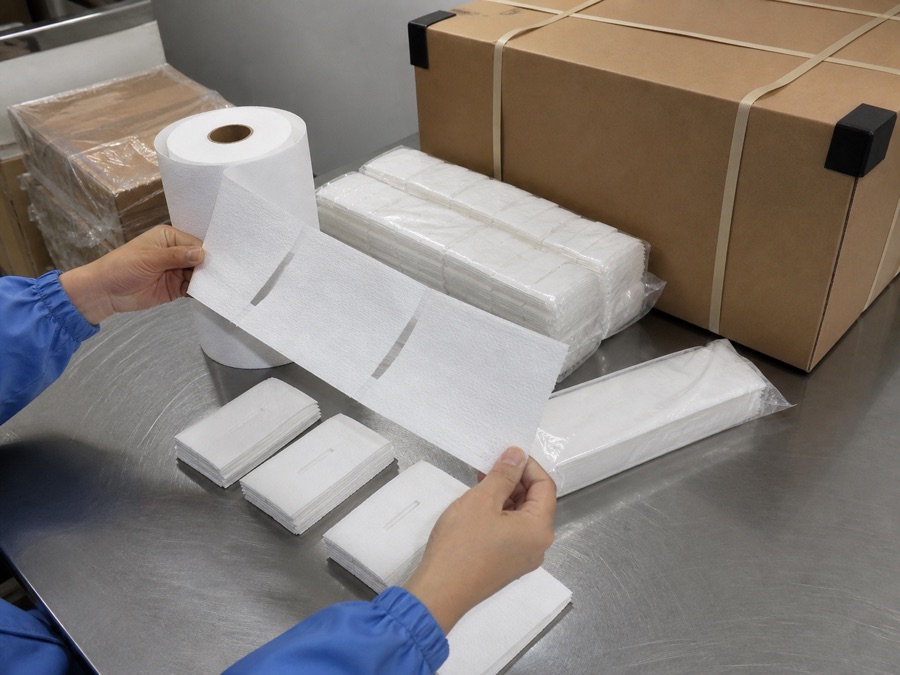Perforated barber neck strips, sealed packs and export carton under inspection