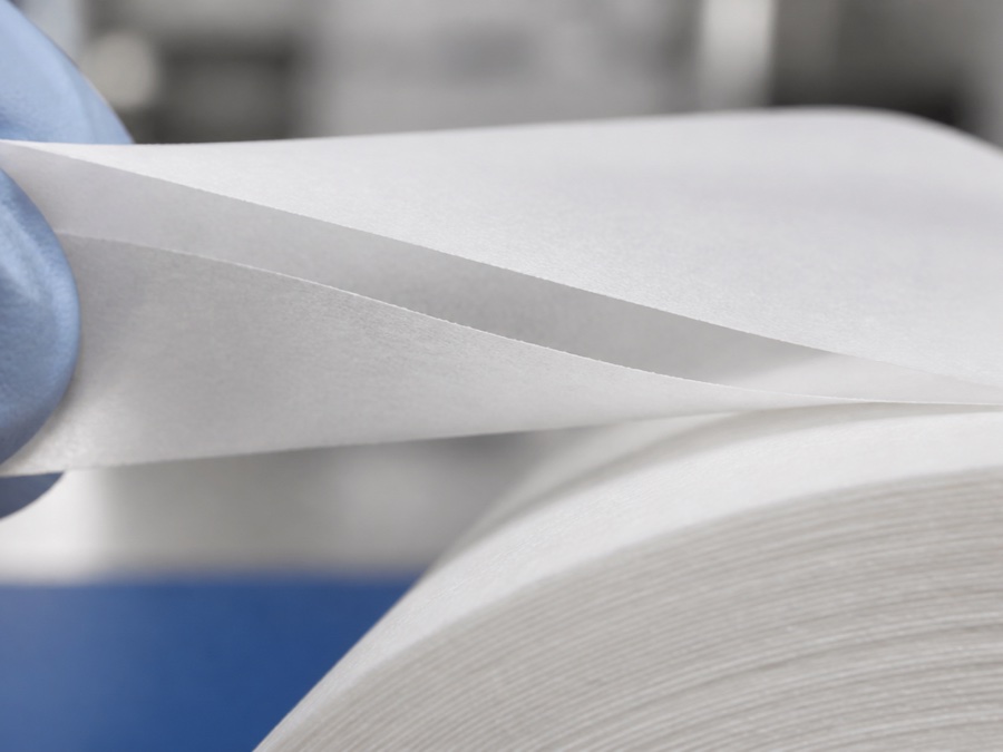 neck strip paper wholesale — macro close-up of thin creped neck strip layers separating cleanly without fiber