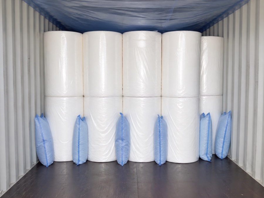 tissue mother roll supplier — container loading inspection showing dry floor clean walls protective top sheet and moisture-control bags placed