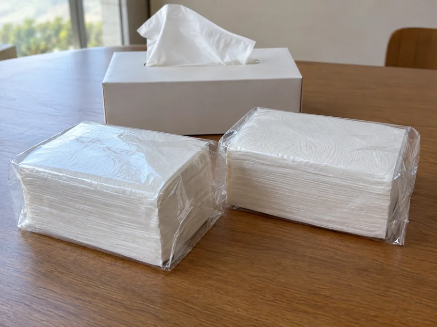 Separately protected facial tissue packs on a clean table